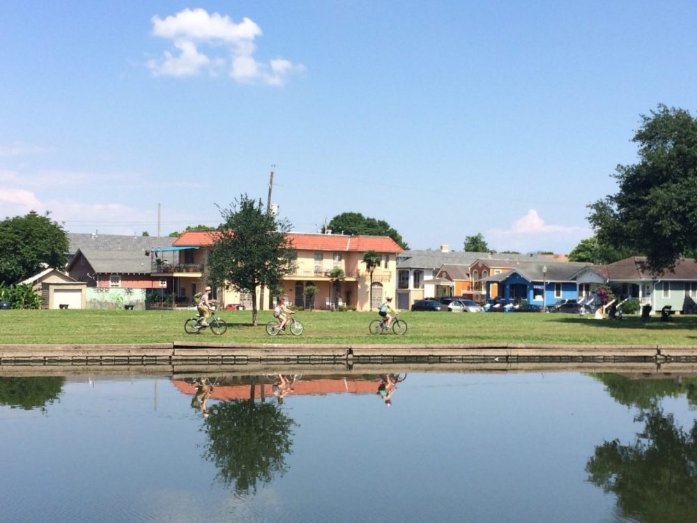 A group of friends bikes along Bayou St. John in New Orleans.